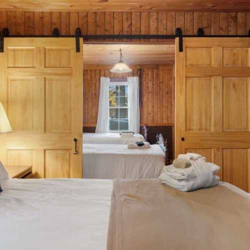 Bedroom #1: King bed on the main floor; note that bedroom 1 and 2 are only separated by sliding doors