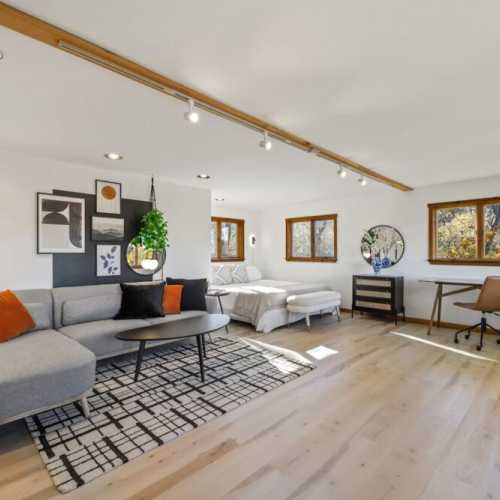 Bedroom 1: King bed, main floor.  Must walk through the living room and upstairs to reach the shower.