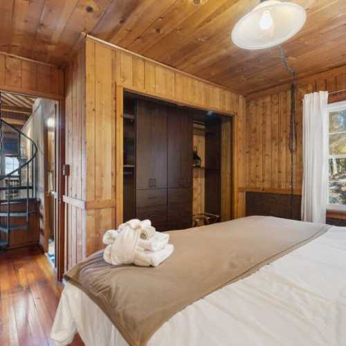 Bedroom #1: King bed on the main floor; note that bedroom 1 and 2 are only separated by sliding doors