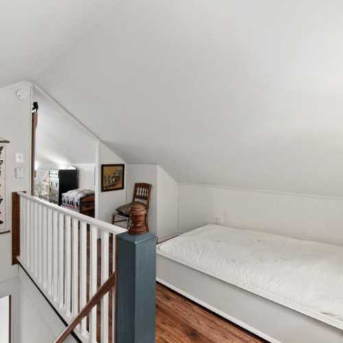 Bedroom #1: king bed on 2nd floor, with en suite half bath and extra single bed