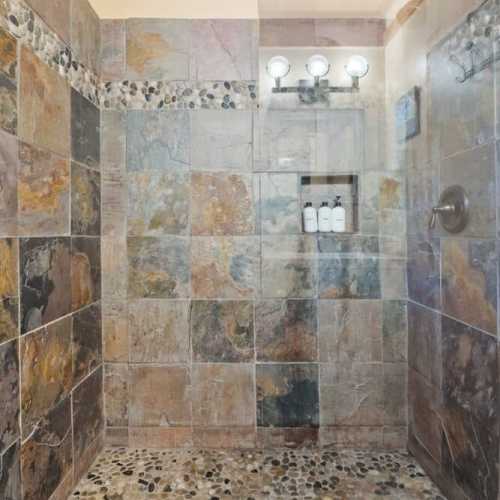 Bathroom 1: Full bath with shower on the main floor; shared by bedroom 1 and 2