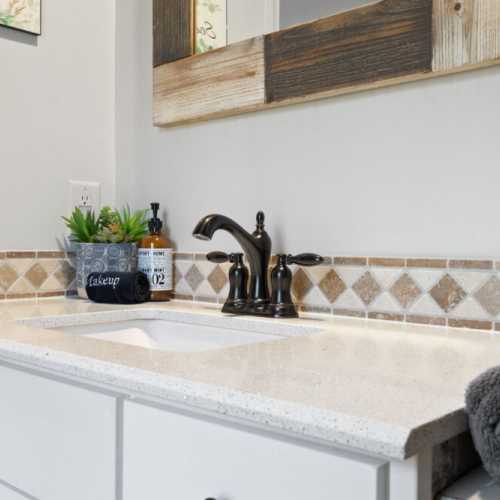 Bathroom #2: full bathroom w/ bathtub/shower combo on main floor; shared by bedroom #2 and #3