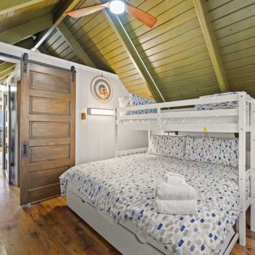 Bedroom #4: king bed with twin bunk above and twin trundle bed below; only accessible by walking through bedroom #3