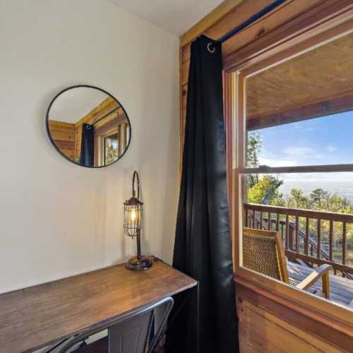Bedroom #1: A desk to work from (if you must!) while enjoying the spectacular view