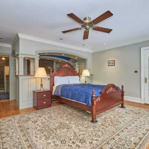 Bedroom #1: queen bed on main floor with en suite full bath and private porch
