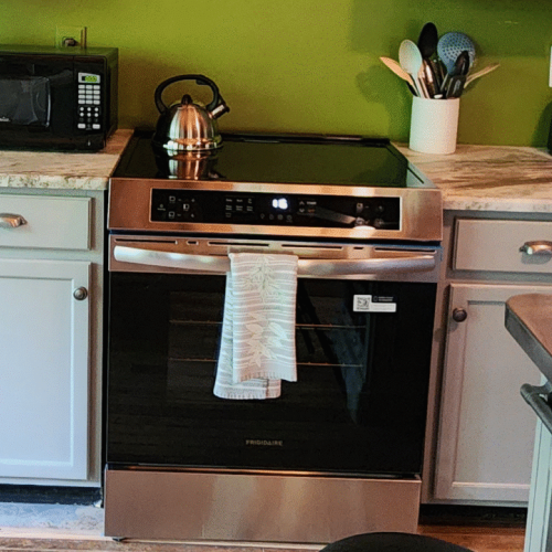 This brand-new and much more functional induction stovetop and oven replaced the antique oven that was here previously.