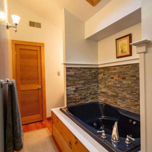 Bathroom #2: full bathroom on 2nd floor with jetted bathtub; there is a shower attachment, but no separate shower
