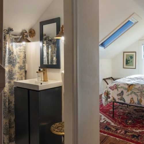 Bedroom #1: king bed on 2nd floor, with en suite half bath and extra single bed