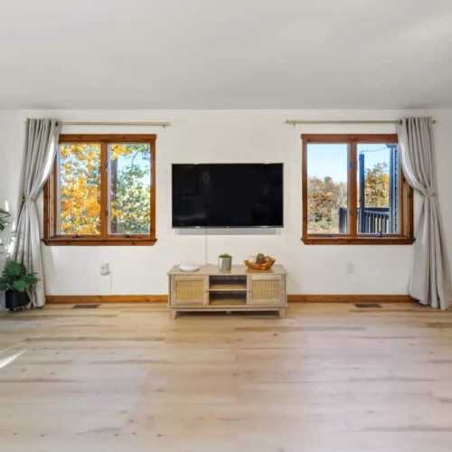 Bedroom 1: King bed, main floor.