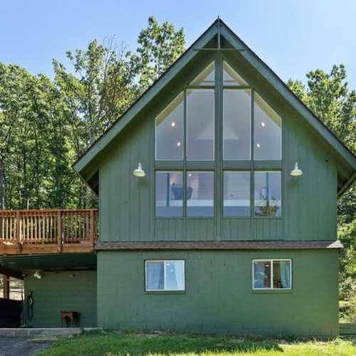 Please note that this photo was taken before the hot tub was added.  The hot tub is located beneath the deck, on the same level as the basement (the lower left corner of this photo).