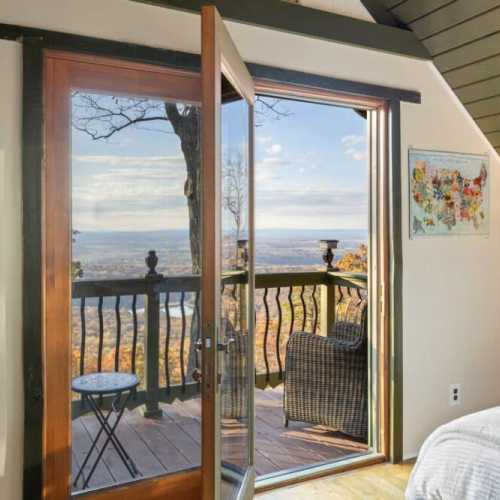 Bedroom #3: king bed, two twin beds on top floor with balcony