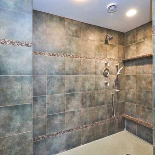 Bathroom #1: full bathroom with shower, en suite to bedroom #1 on the main floor