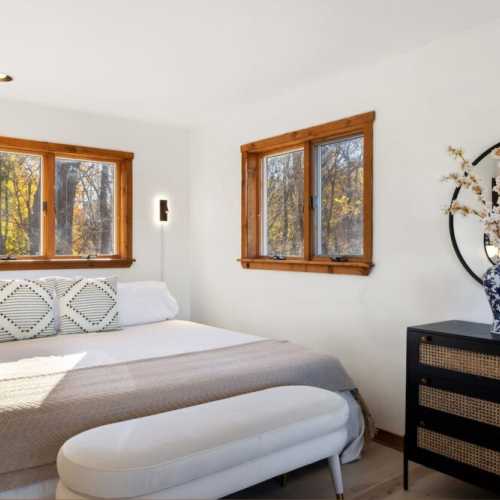 Bedroom 1: King bed, main floor.  Must walk through the living room and upstairs to reach the shower.