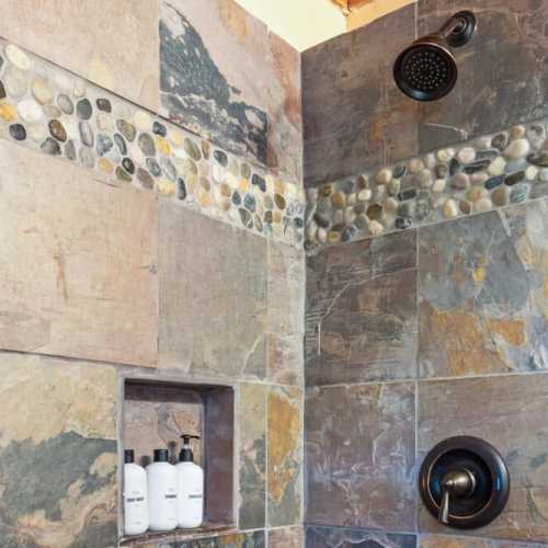 Bathroom 1: Full bath with shower on the main floor; shared by bedroom 1 and 2