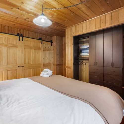 Bedroom #1: King bed on the main floor; note that bedroom 1 and 2 are only separated by sliding doors