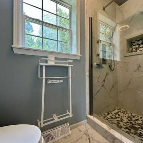 Bathroom #1: full bathroom with separate shower and bathtub; en suite to bedroom 1