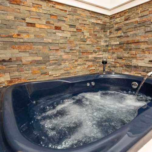 Bathroom #2: full bathroom on 2nd floor with jetted bathtub; there is a shower attachment, but no separate shower