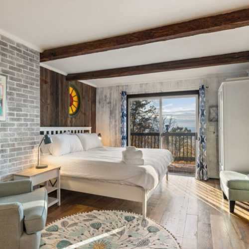 Bedroom #1: king bed on main floor with en suite bathroom. This is a separate studio that is accessed from the front deck (it is not accessible from within the cabin).