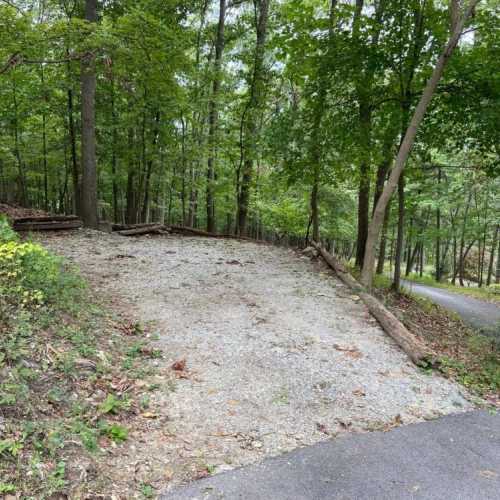 This is a parking pad large enough for two cars up near the road, in case the driveway is too slick to drive up or down.