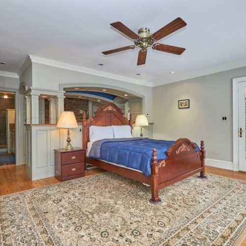 Bedroom #1: queen bed on main floor with en suite full bath and private porch