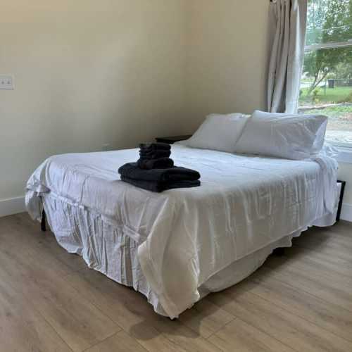 Bedroom #1: queen bed on main floor w/ en suite bathroom