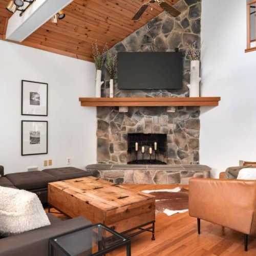 Gather in the living room around the fireplace (now fully functional for wood fires) while meals are prepped and enjoy a board game or log into your streaming account.