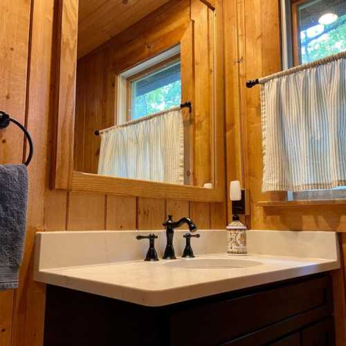 Bathroom #1: Main floor full bath with shower, shared by lower bedrooms and great room