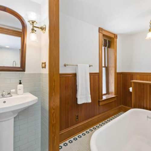 Bathroom #1: main floor, bathtub without a shower