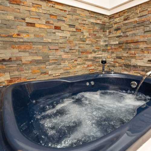 Bathroom #2: full bathroom on 2nd floor with jetted bathtub; there is a shower attachment, but no separate shower