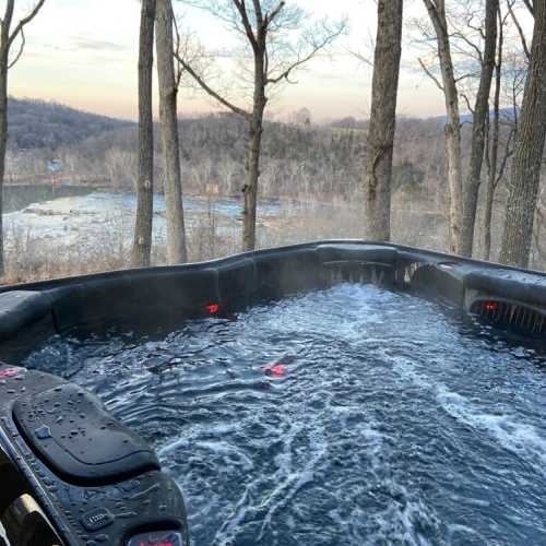 Soak in the tub while enjoying the beautiful view of the river below!