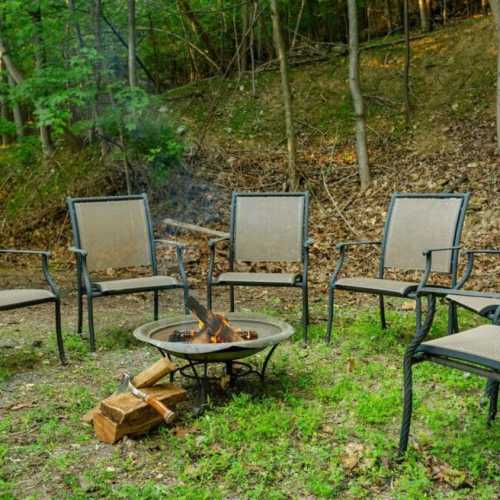 The fire pit in the back of the house means you can enjoy the great outdoors even after the sun sets and the temperature drops (firewood and hatchet not provided).
