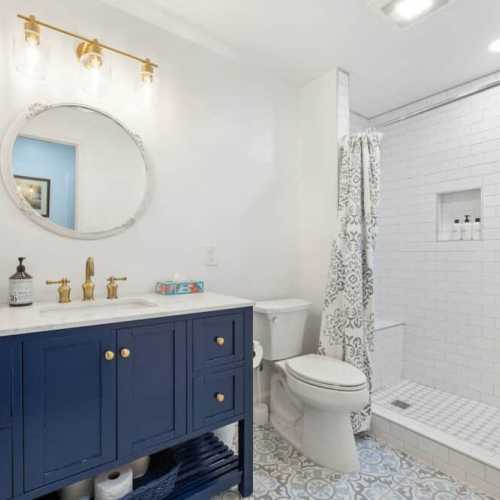 Bathroom #3: full bathroom with shower on lower level; en suite for bedroom #4, and serves the lower level