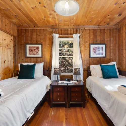 Bedroom #2: Two twin beds on the main floor; note that bedroom 1 and 2 are only separated by sliding doors