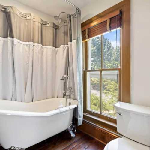 Bathroom #4: en suite bathroom for bedroom #4 with claw foot tub/shower combo