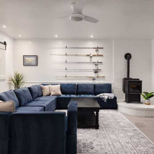 Gather in the downstairs movie room (or send the kids down there!) & log into your streaming account to pick up where you left off on Netflix!
Note: This is currently a NON-WORKING fireplace. The fireplace on the main floor is functional.