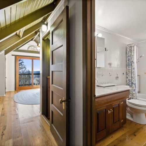 Bathroom #3: full bathroom with bathtub/shower combo, shared by bedroom #3 and #4