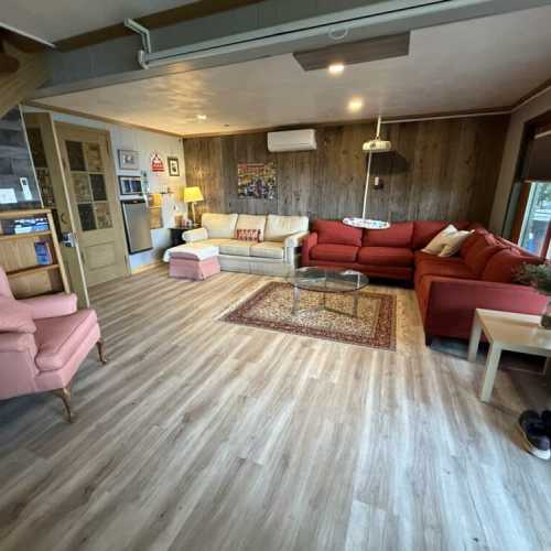 Basement living room with a projector screen