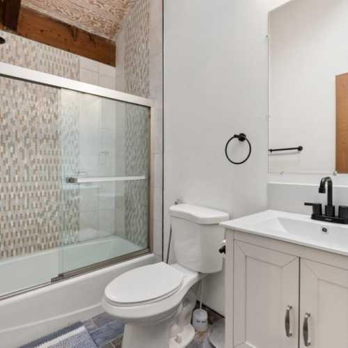 Bathroom #1: full bathroom with bathtub/shower combo; en suite bathroom for bedroom #1