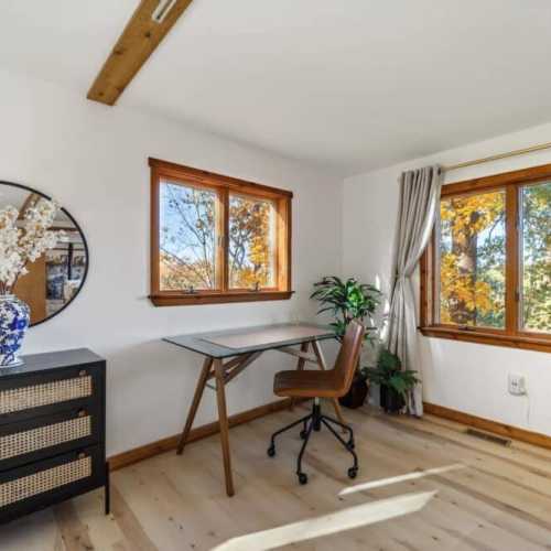 Bedroom 1: King bed, main floor.