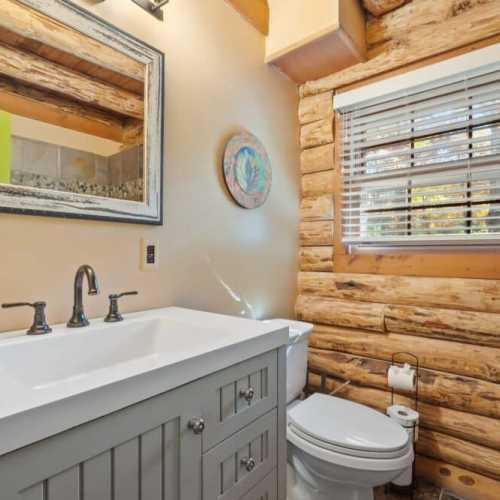 Bathroom 1: Full bath with shower on the main floor; shared by bedroom 1 and 2