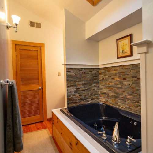 Bathroom #2: full bathroom on 2nd floor with jetted bathtub; there is a shower attachment, but no separate shower