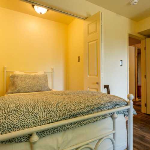 Bedroom #3: bunk bed and separate twin bed, lower level with access to the patio beneath the deck