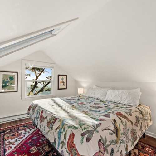 Bedroom #1: king bed on 2nd floor, with en suite half bath and extra single bed