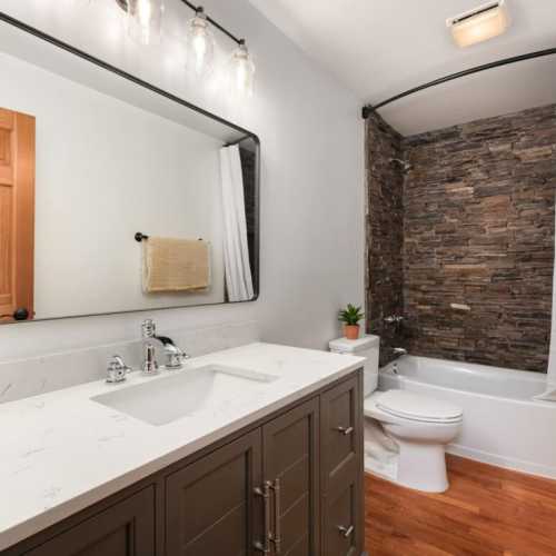 Bathroom 2: bathtub/shower combo on the main floor; bathroom is shared by bedrooms #2 and #3, as well as the living area