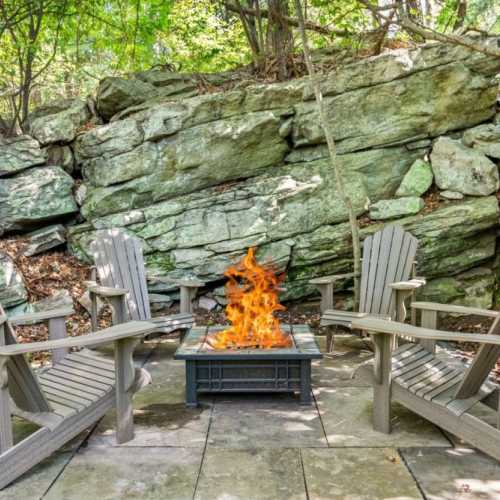 This boulder fire pit is the perfect place to wind down the evening